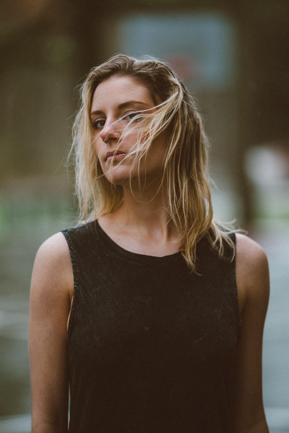 Free Image of Woman With Hair Blowing in the Wind 