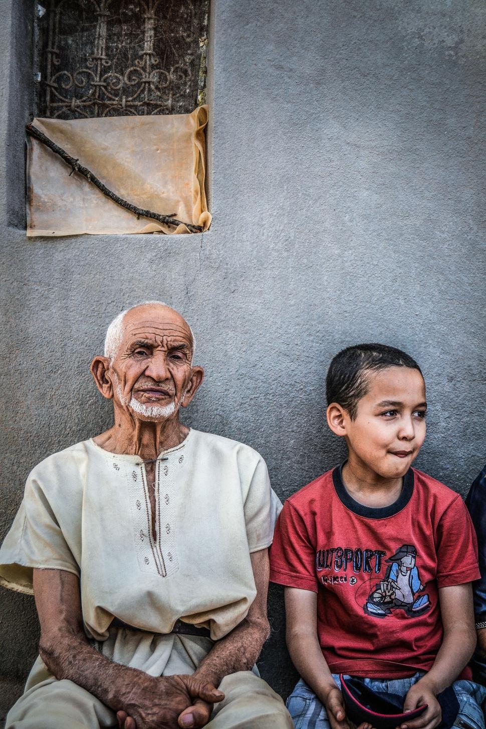 Free Image of Two People Sitting Next to Each Other 