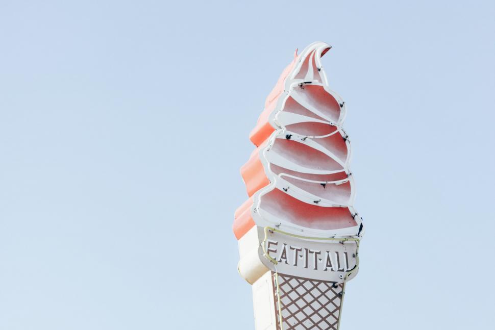 Free Image of Tall Ice Cream Cone Atop Building 