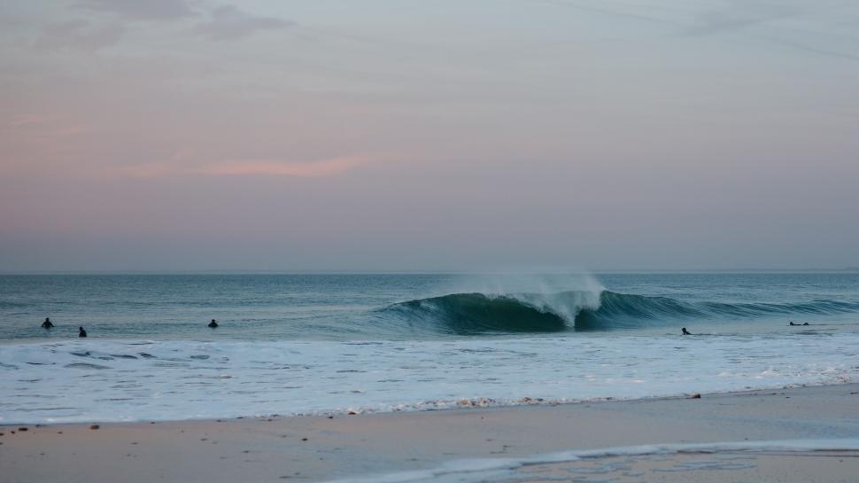 Free Image of Person Riding Surfboard on Ocean Wave 