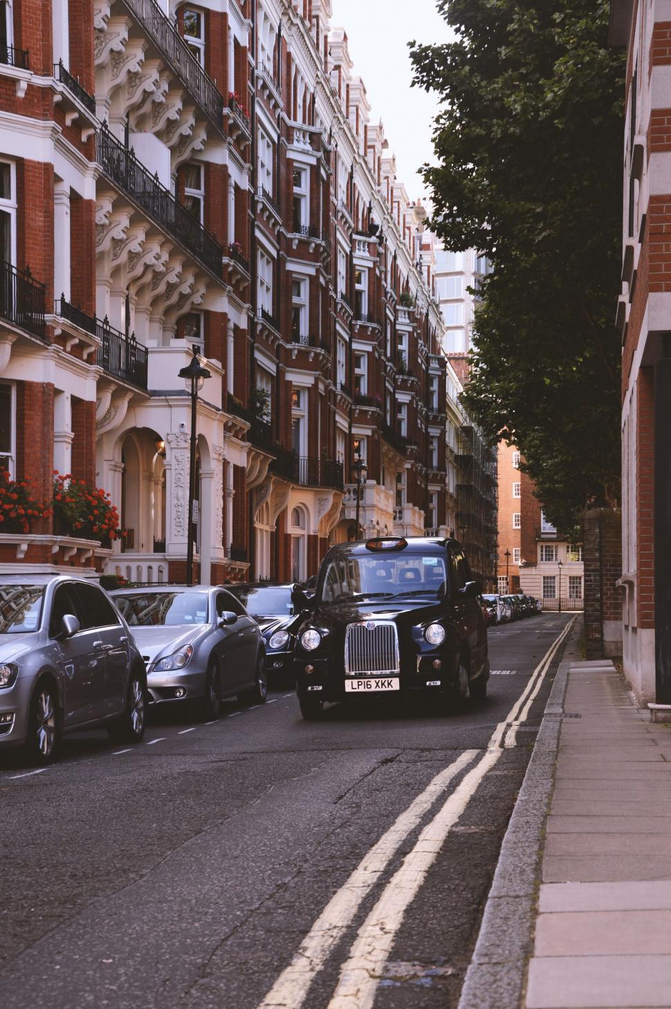 Free Image of Row of Parked Cars on City Street 