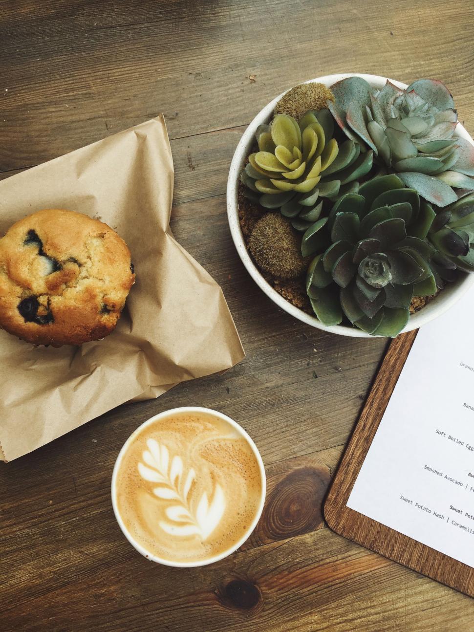 Free Image of Coffee Cup and Cookie on Table 