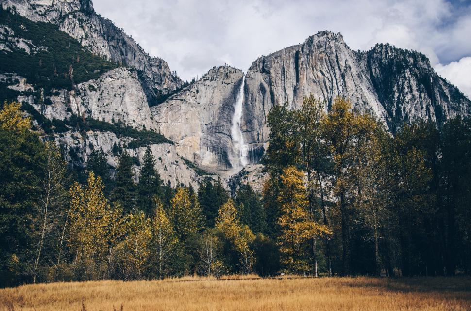 Free Image of Majestic Mountain With Waterfall in Background 