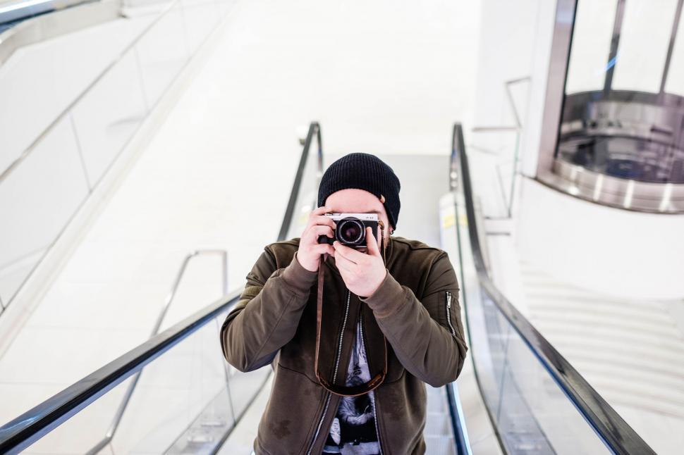 Free Image of Man Taking Selfie on Escalator 