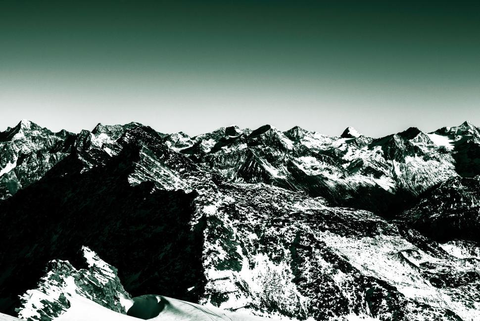 Free Image of Snowboarder Riding in the Mountains 