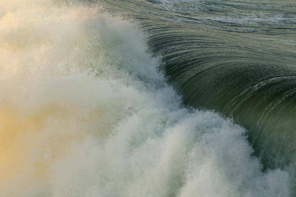 Free Image of Man Riding Wave on Surfboard 