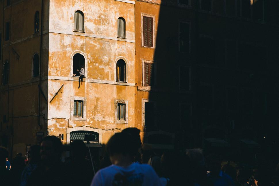 Free Image of Group of People Standing in Front of Tall Building 