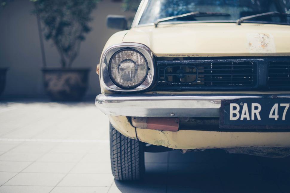 Free Image of Old Car Parked in Driveway 