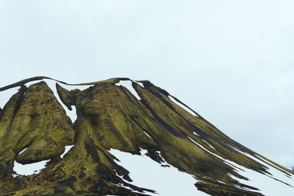Free Image of Snow Covered Mountain With Snowboarder 
