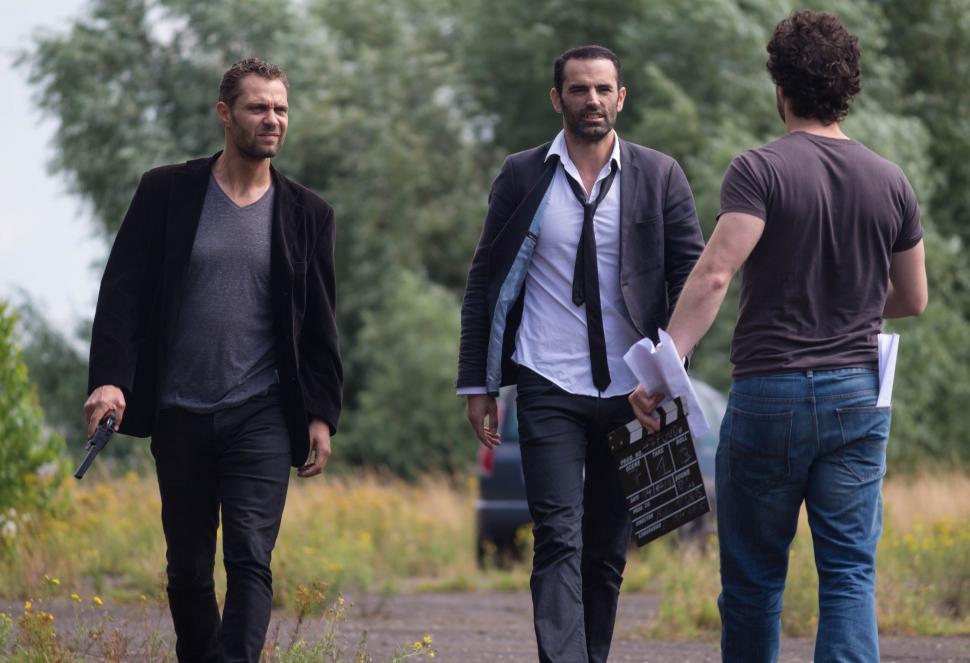 Free Image of Group of Men Walking Down a Dirt Road 