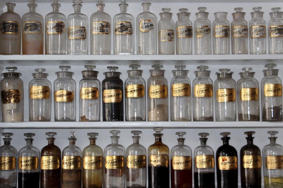Free Image of Shelf Filled With Bottles of Liquid 