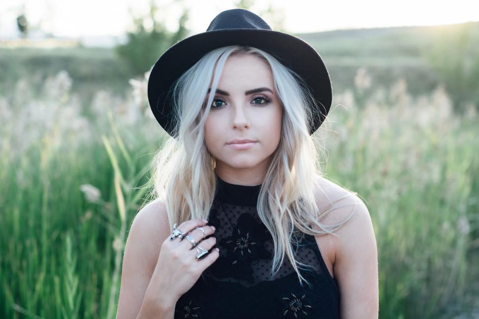 Free Image of Woman With Blonde Hair Wearing Black Hat 