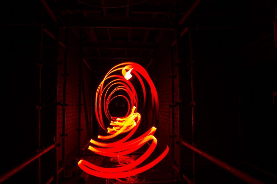 Free Image of Long Exposure of Red Light in Dark Room 
