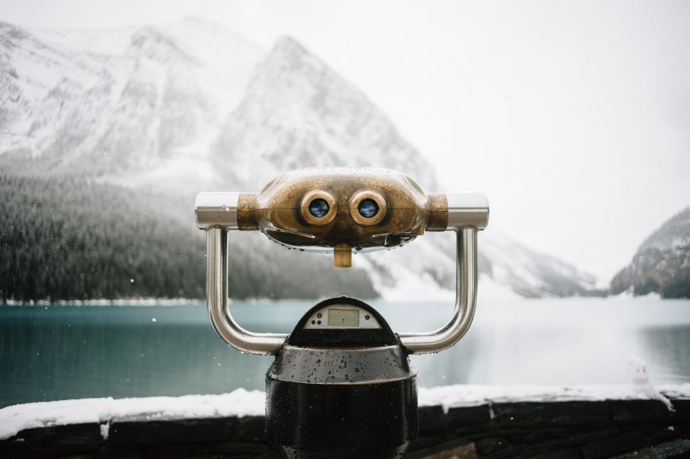 Free Image of Close Up of Camera With Mountains in the Background 