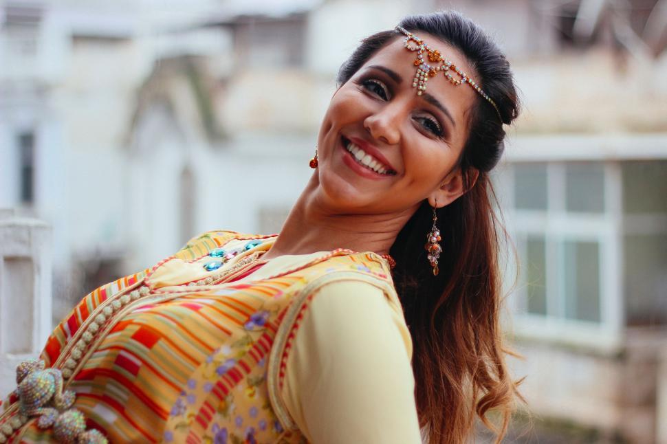 Free Image of Smiling Woman in Colorful Dress 