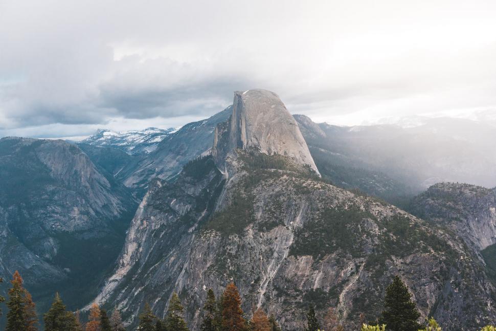 Free Image of Cloudy Sky Over Mountain Summit 
