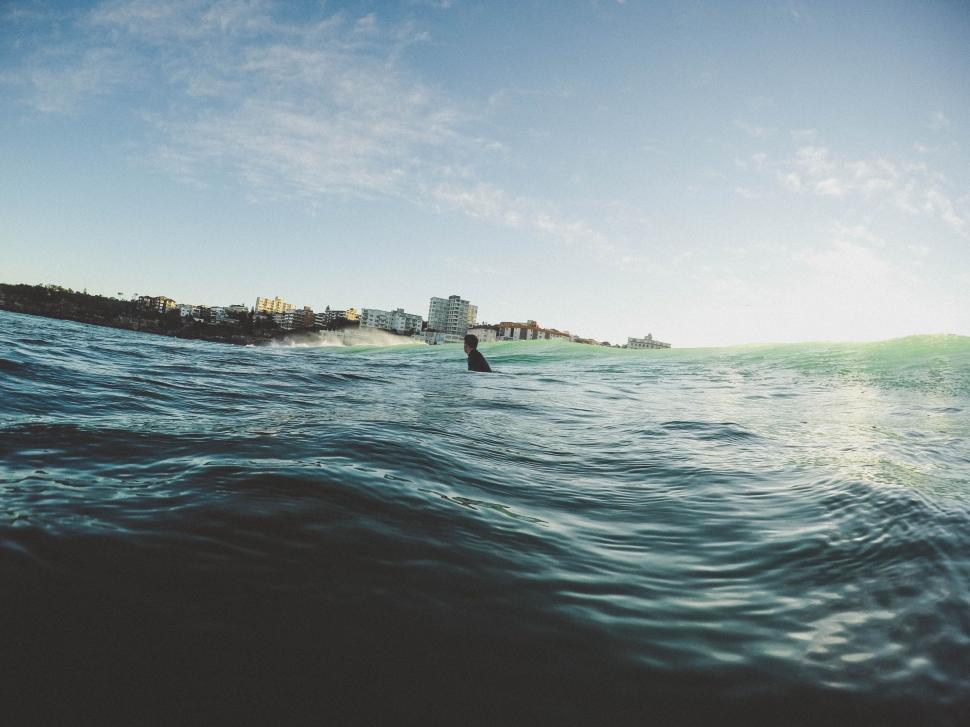 Free Image of Man Riding Surfboard on Top of Wave in Ocean 