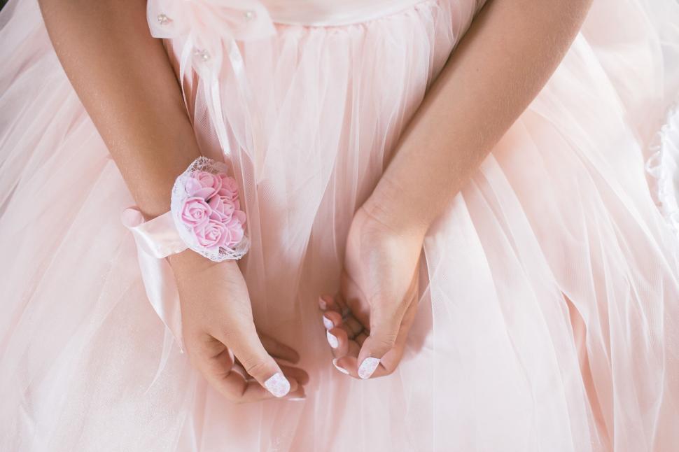 Free Image of Hand of a woman in a dress 