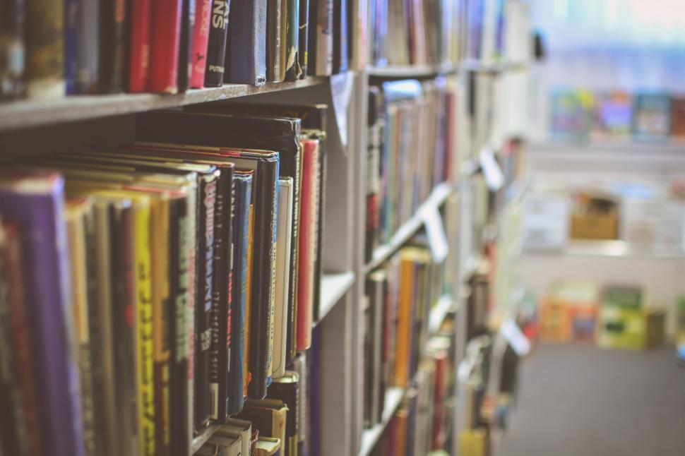 Free Image of Organized Bookshelf Filled With Various Titles 
