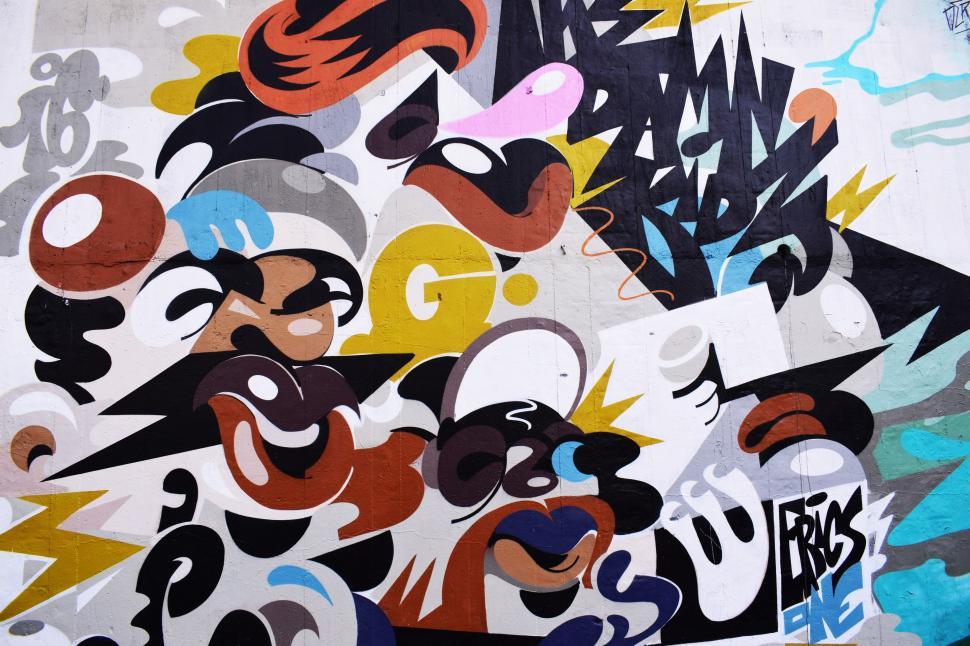 Free Image of Urban Wall Covered in Various Graffiti Tags 