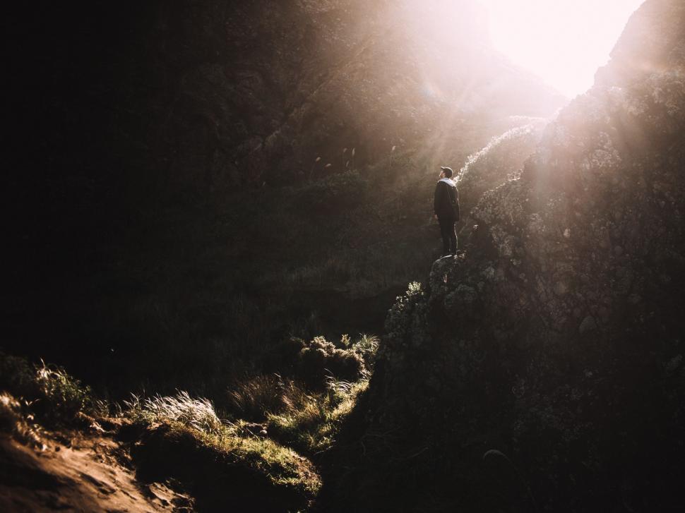 Free Image of Man Standing on Edge of Cliff 