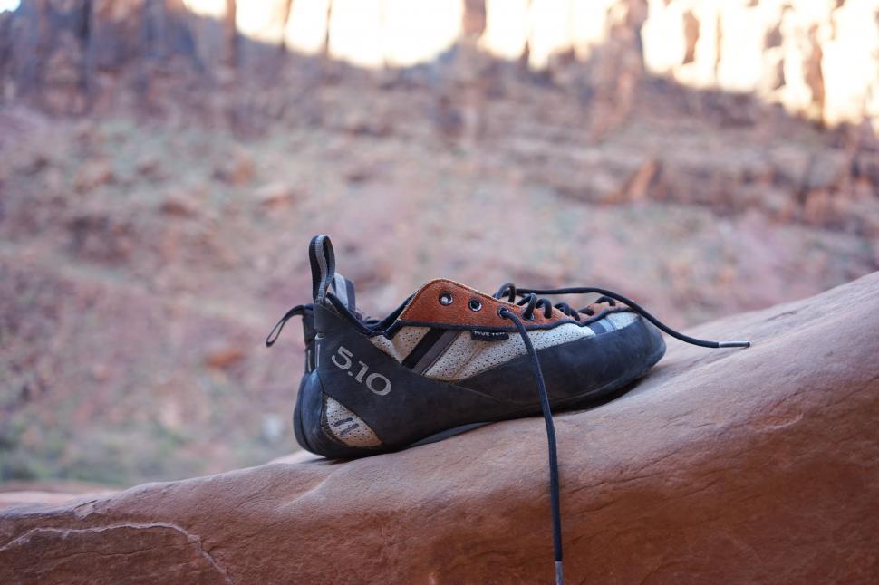 Free Image of Shoes Resting on Top of a Rock 