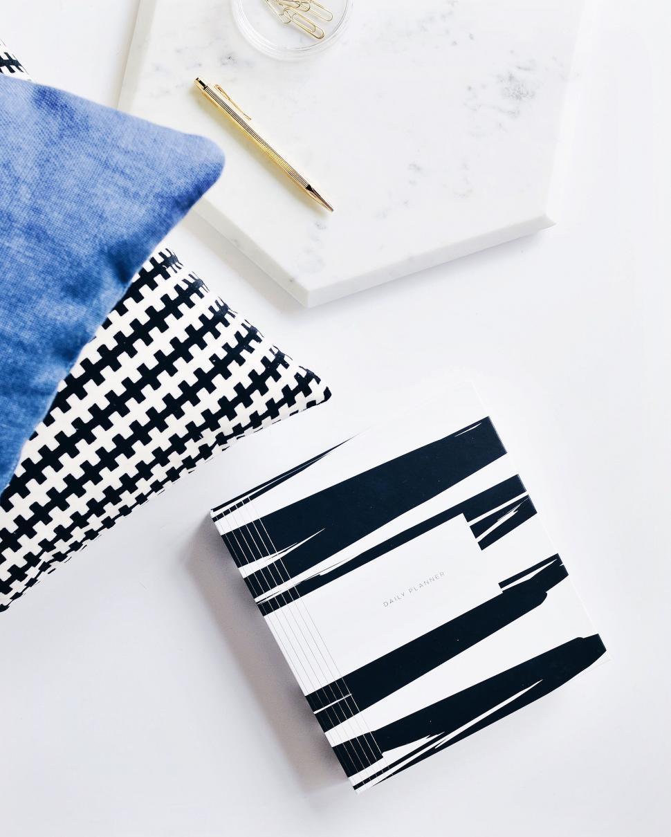 Free Image of White Table With Black and White Pillows 