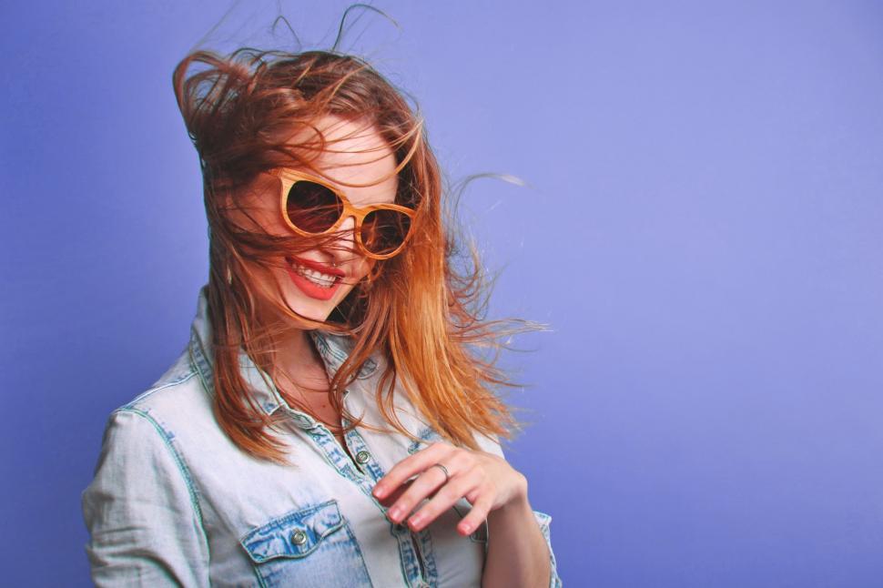 Free Image of Woman Wearing Sunglasses and Denim Shirt 