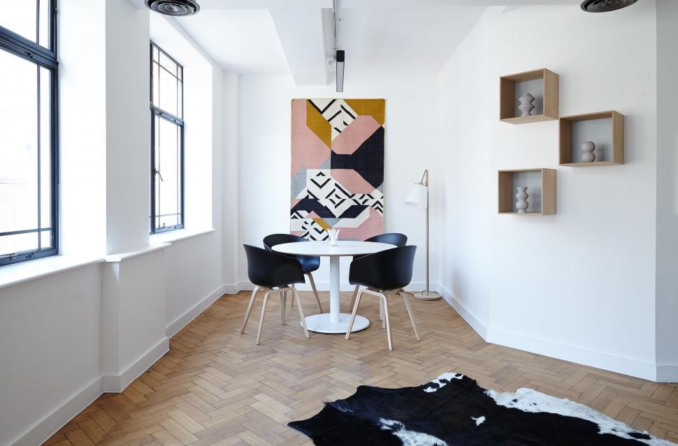 Free Image of Room With Table, Chairs, and Painting on Wall 