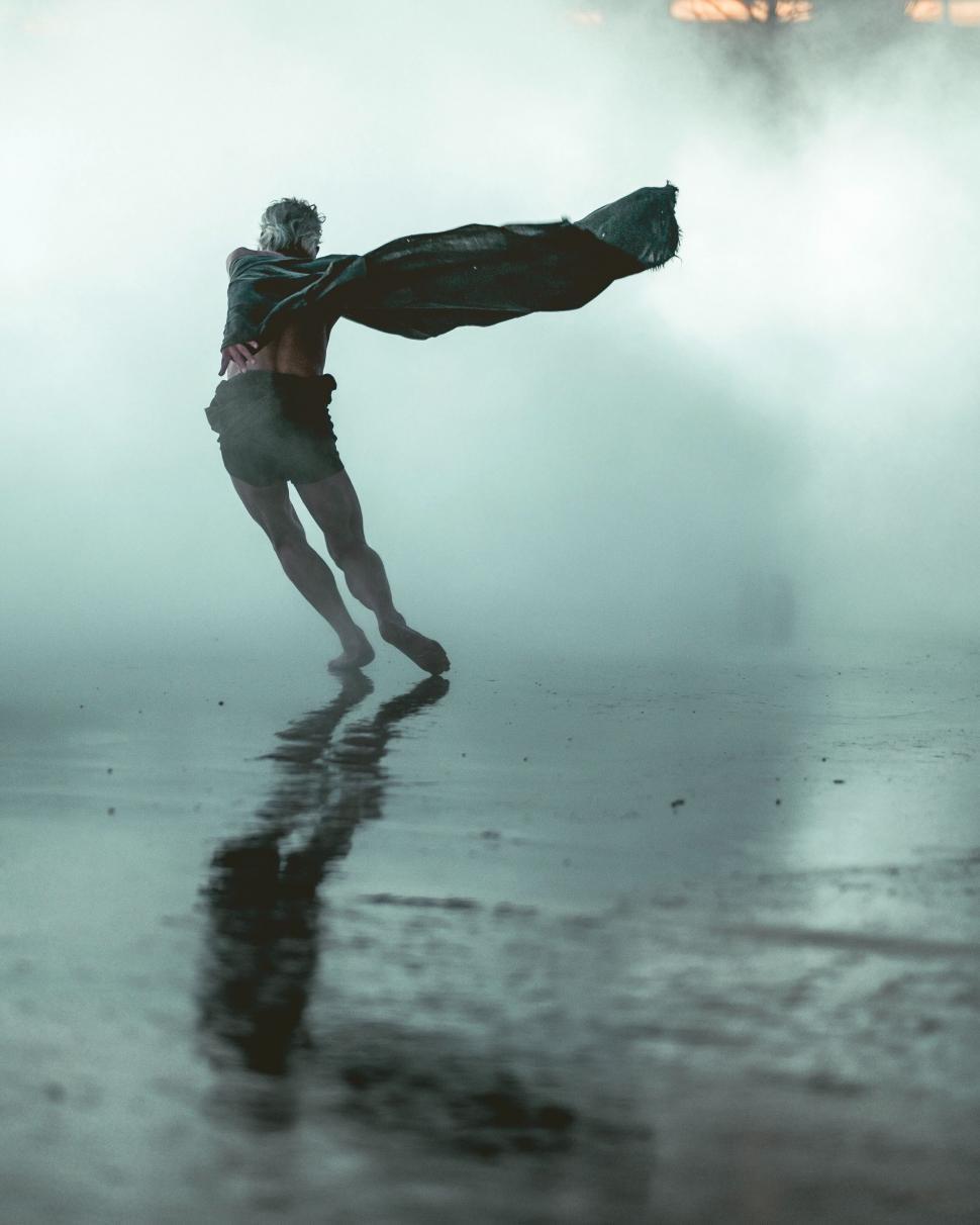 Free Image of Man Standing in Foggy Street 