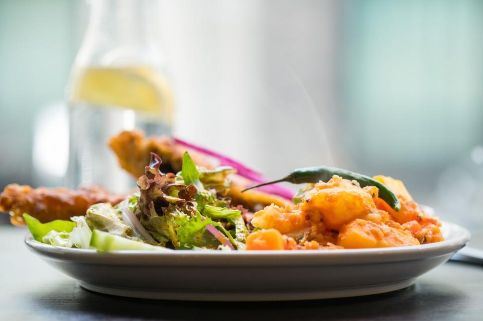 Free Image of Plate of Food and Glass of Wine on Table 