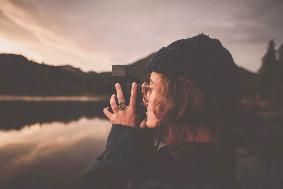 Free Image of Woman Taking a Picture With Her Cell Phone 