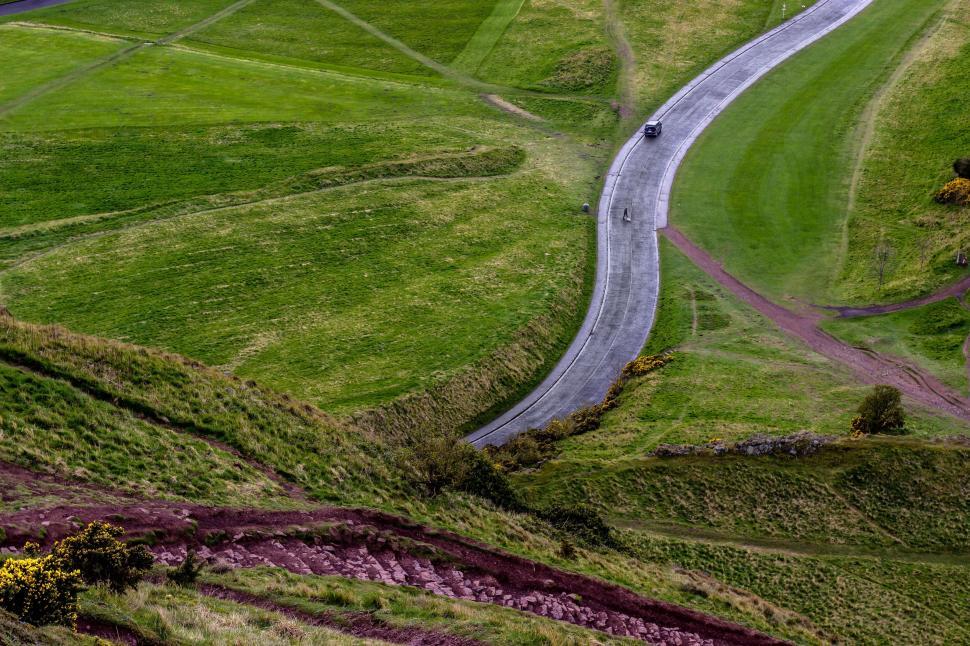 Free Image of Car Driving Down Winding Road 