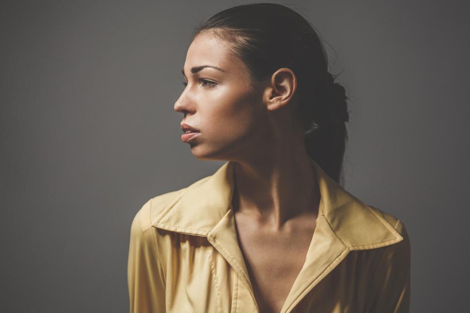 Free Image of Woman in Trench Coat Posing for Picture 