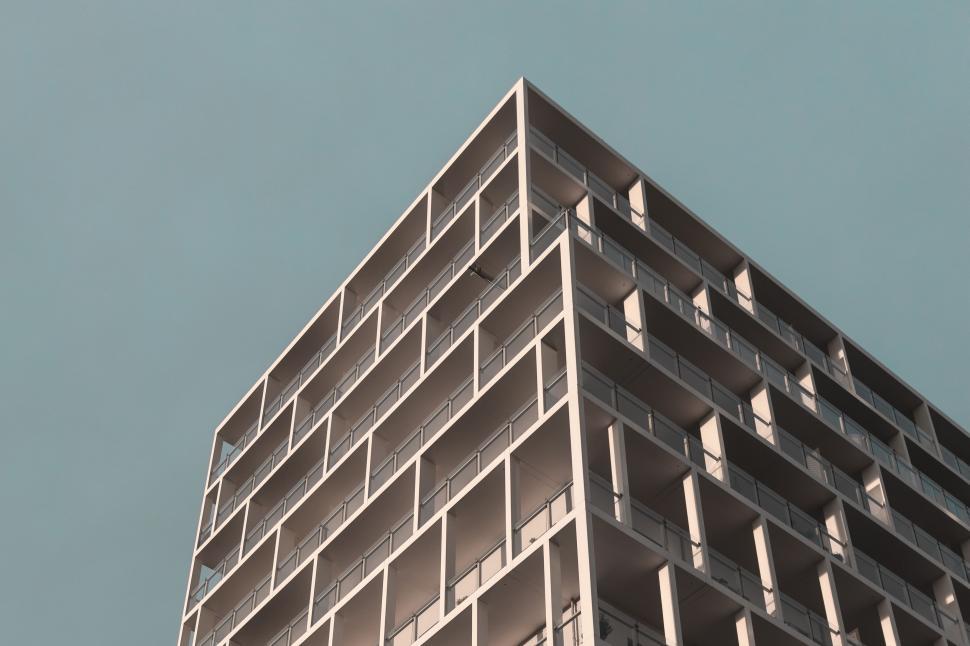 Free Image of Tall Building With Clock on Its Side 