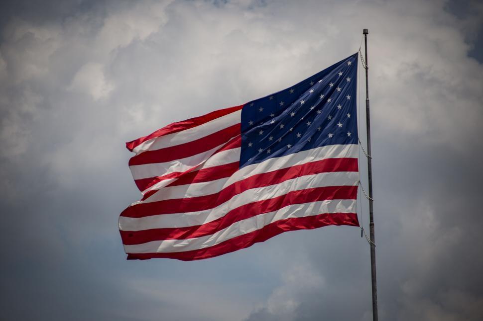 Free Image of Large American Flag Flying in the Sky 