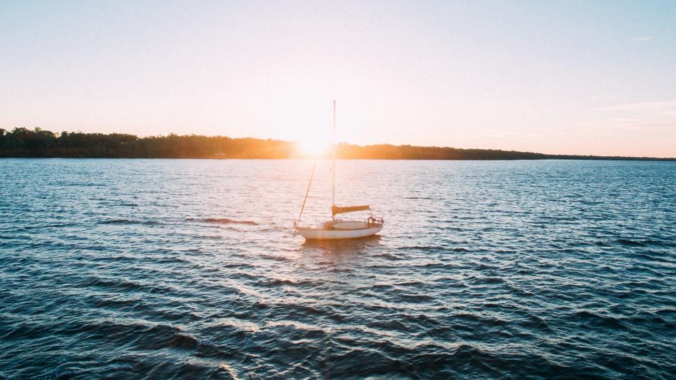 Free Image of Sailboat Floating in Vast Ocean 