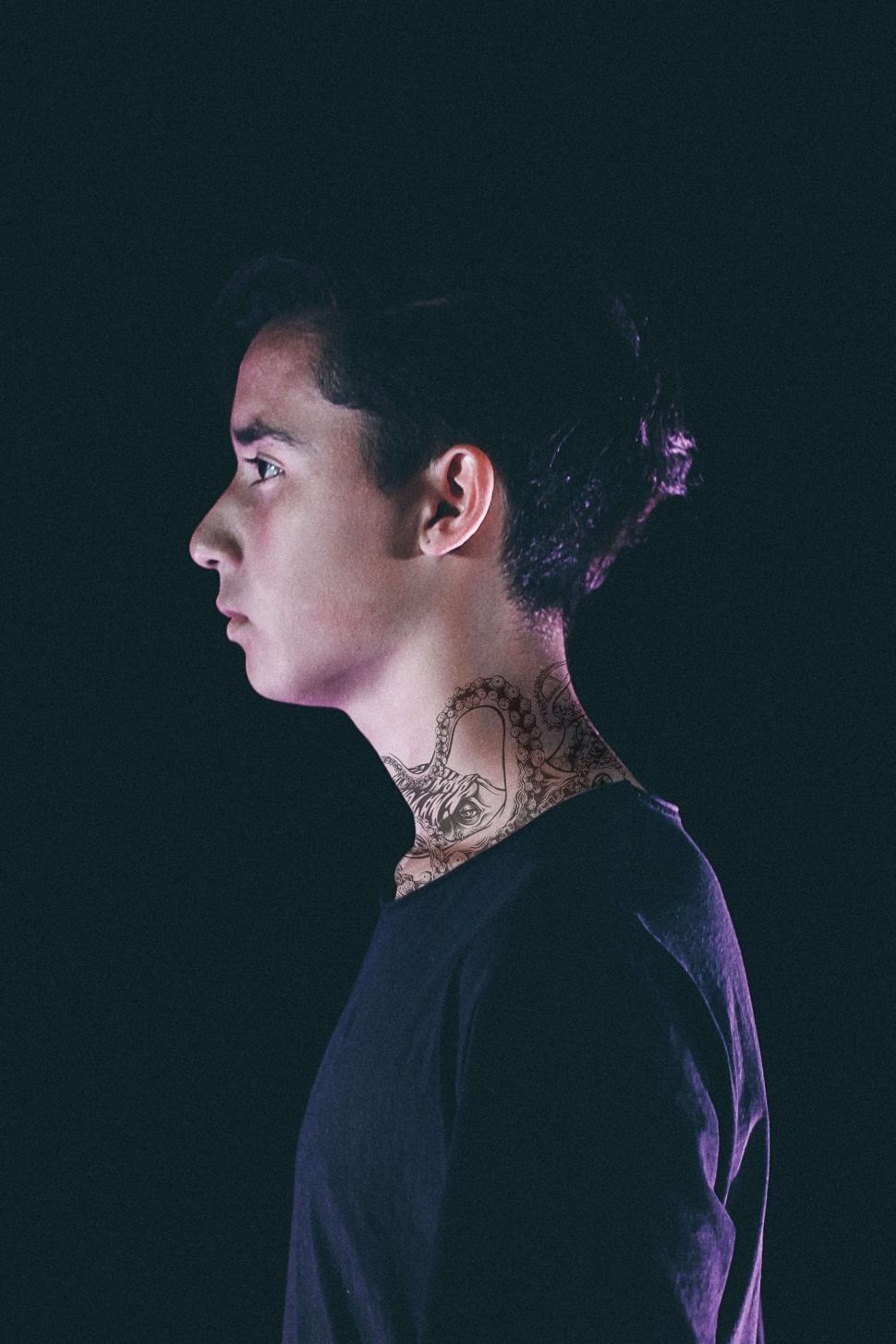 Free Image of Woman With Tattoo on Neck 