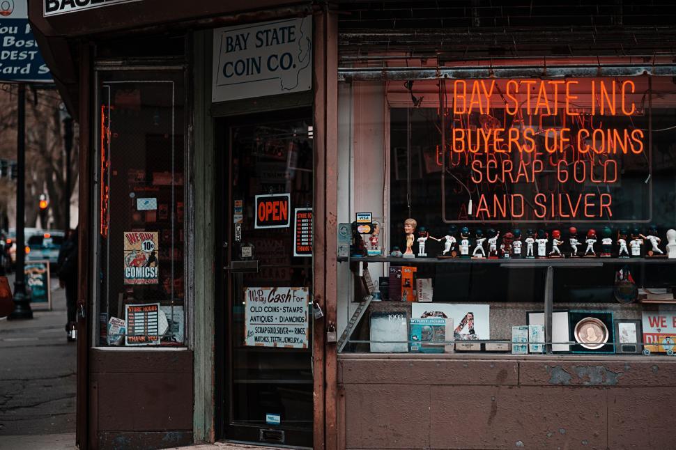 Free Image of Neon Sign in Store Front Window 