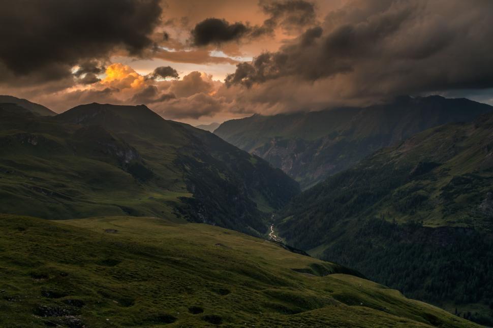 Free Image of Sun Setting Over Mountain Range 