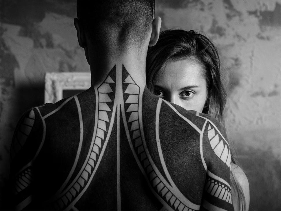Free Image of Man and Woman With Back Tattoos 