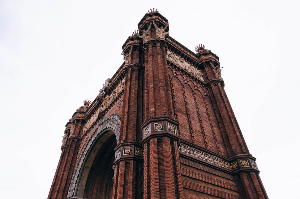 Free Image of Tall Brick Building With Clock 