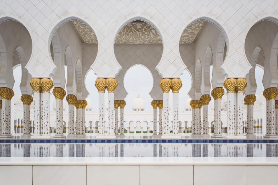 Free Image of White and Gold Building With Arches and Pillars 
