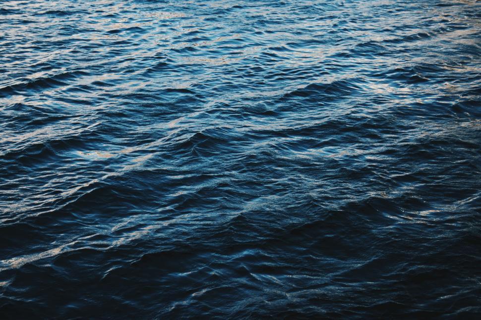 Free Image of Boat Sailing on a Vast Body of Water 