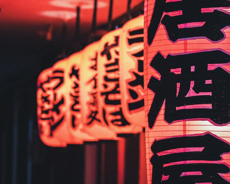 Free Image of Group of Chinese Lanterns Hanging From a Ceiling 