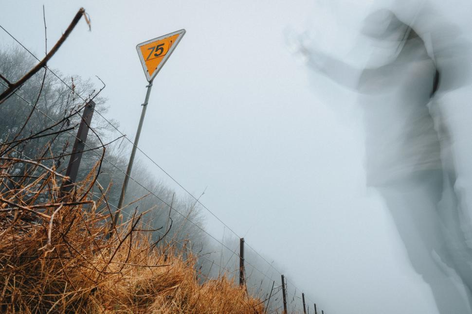 Free Image of Blurry Photo of Man Standing in Snow 
