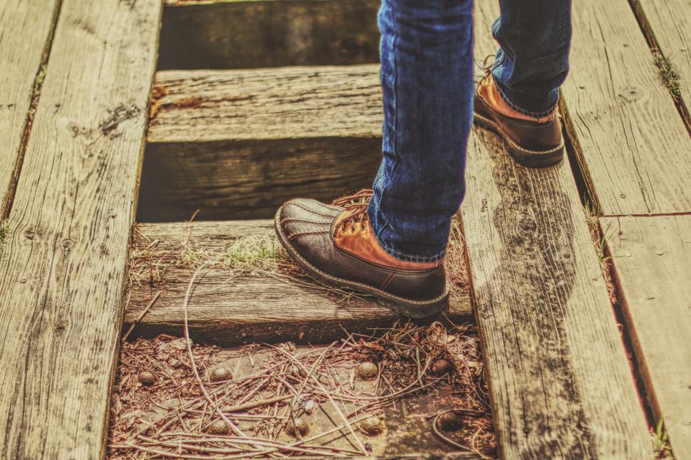 Free Image of Person Standing on a Wooden Platform 