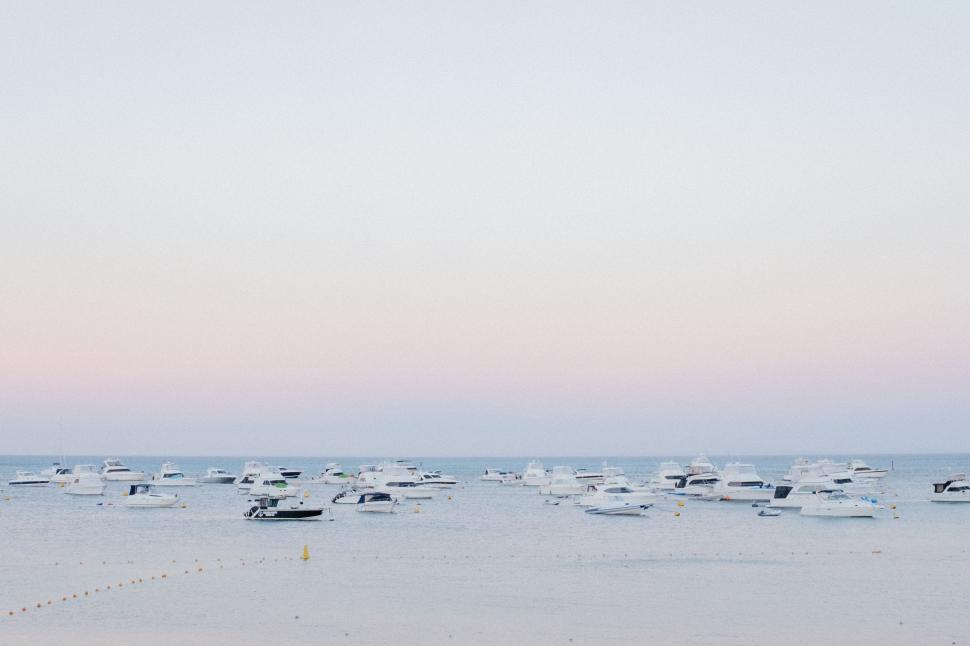 Free Image of Group of Boats on Sandy Beach 