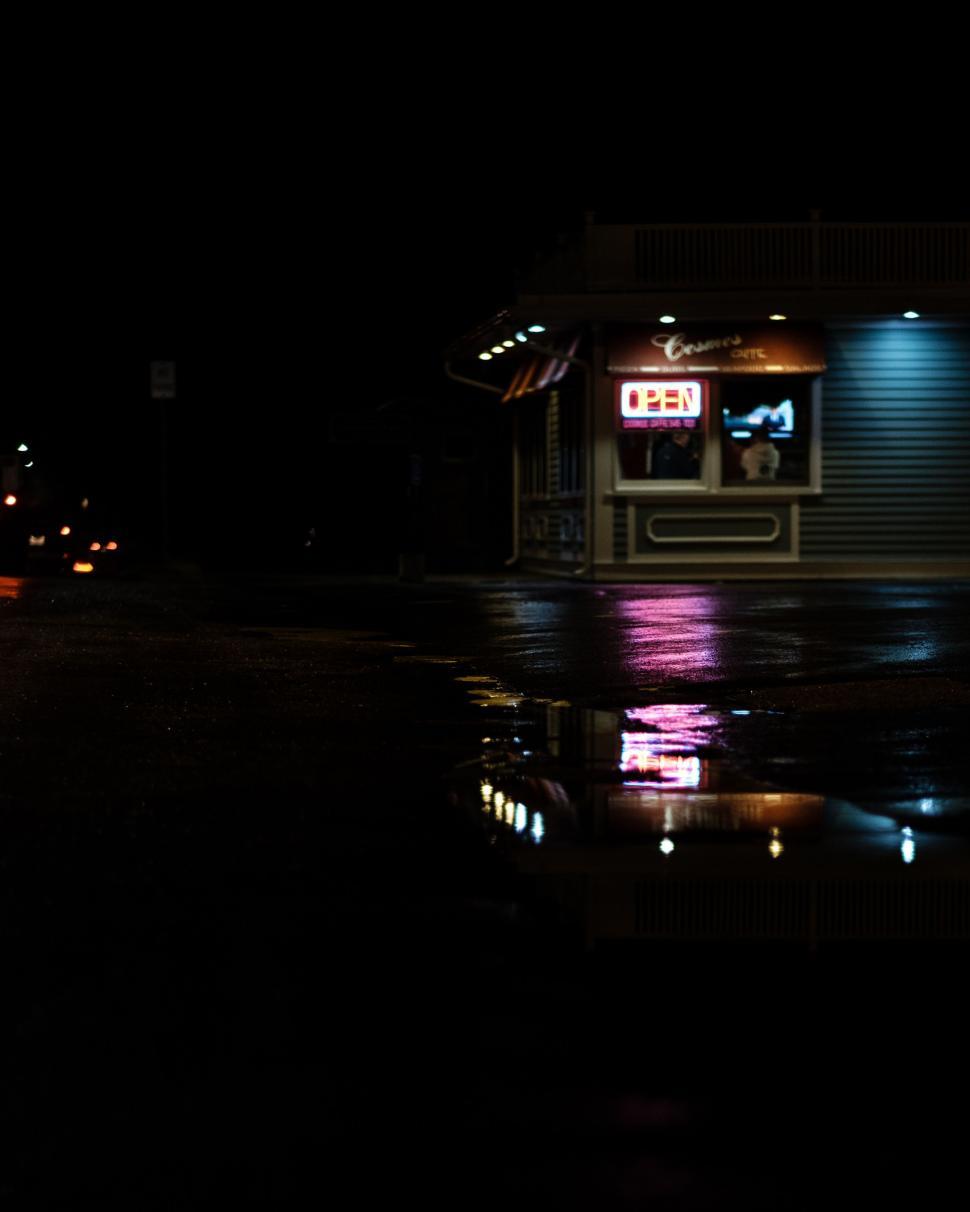 Free Image of Dark Street With Small Building 