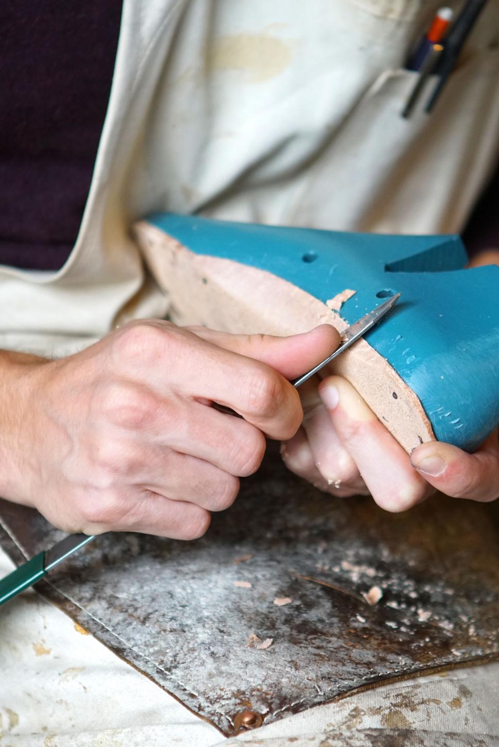 Free Image of Person Using Scissors to Cut Wood 